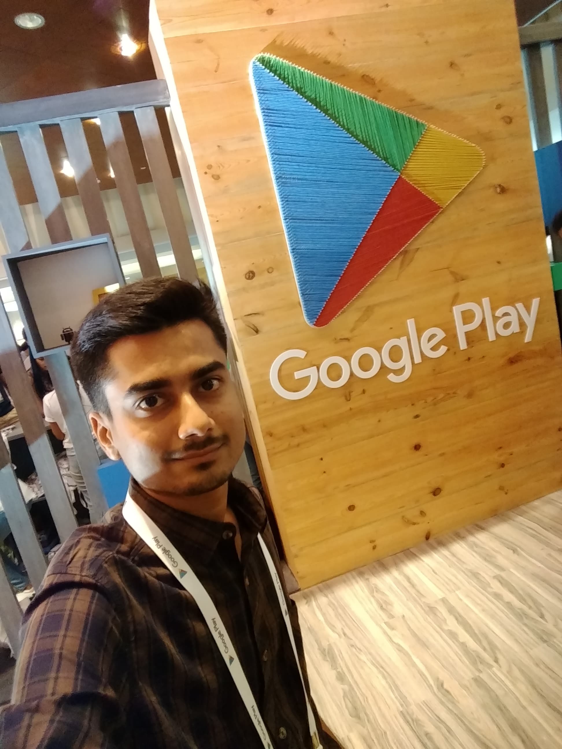 Selfie in front of the string-art Google Play logo at the App Excellence Summit.