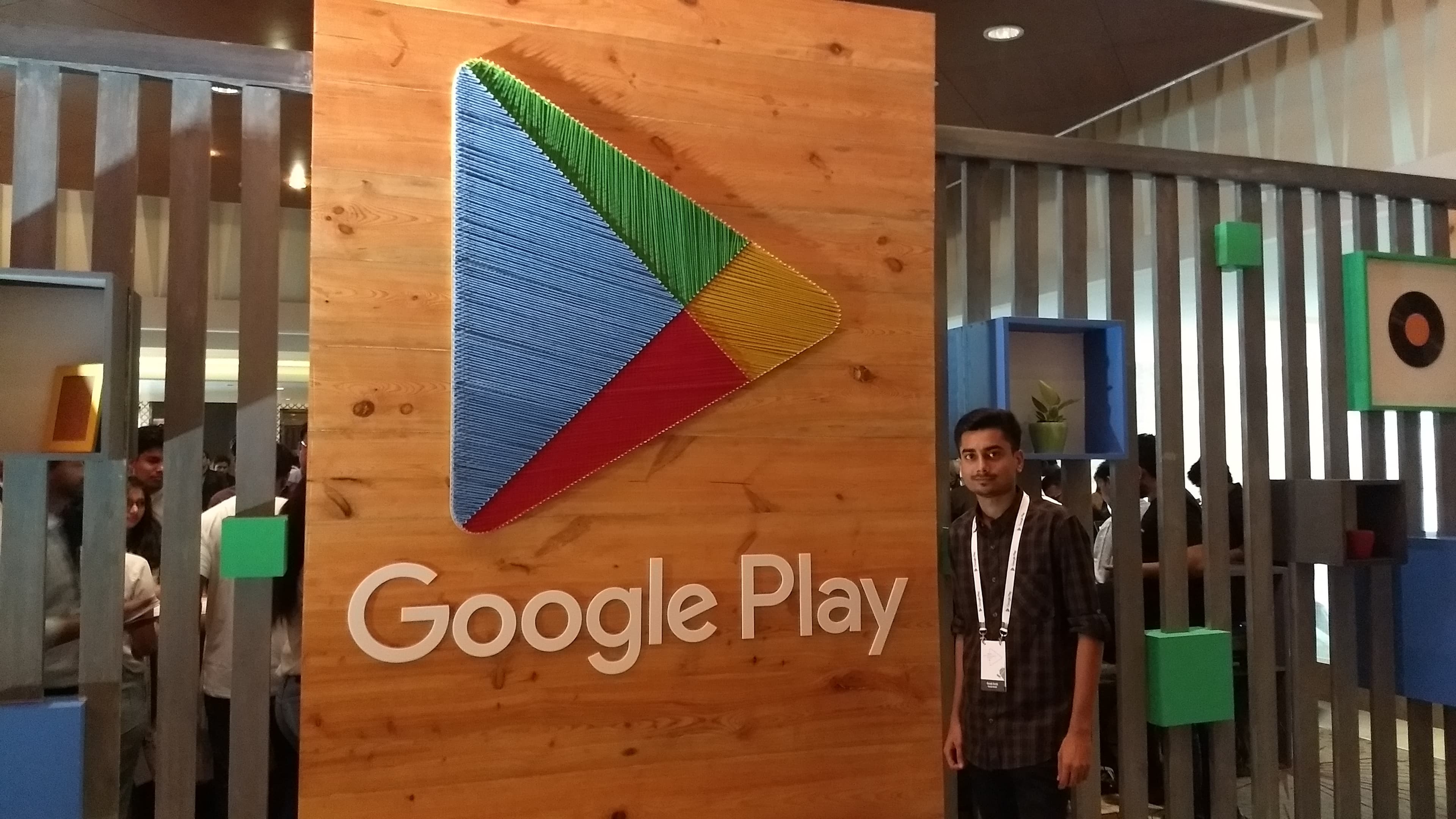 Ronak standing beside the Google Play sign at the App Excellence Summit.